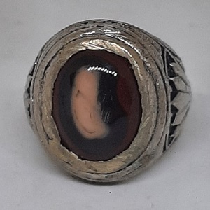 small ring with unique stone that has white figure in midle of stone like woman in last tashahud shalat, blessed by spiritualist
