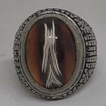 unique like arrow or shield symbols stone in ring blessed by spiritualist