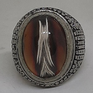 unique like arrow or shield symbols stone in ring blessed by spiritualist