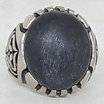black fosil wood stone in ring blessed by spiritualist as charisma and protection