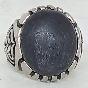 black fosil wood stone in ring blessed by spiritualist as charisma and protection